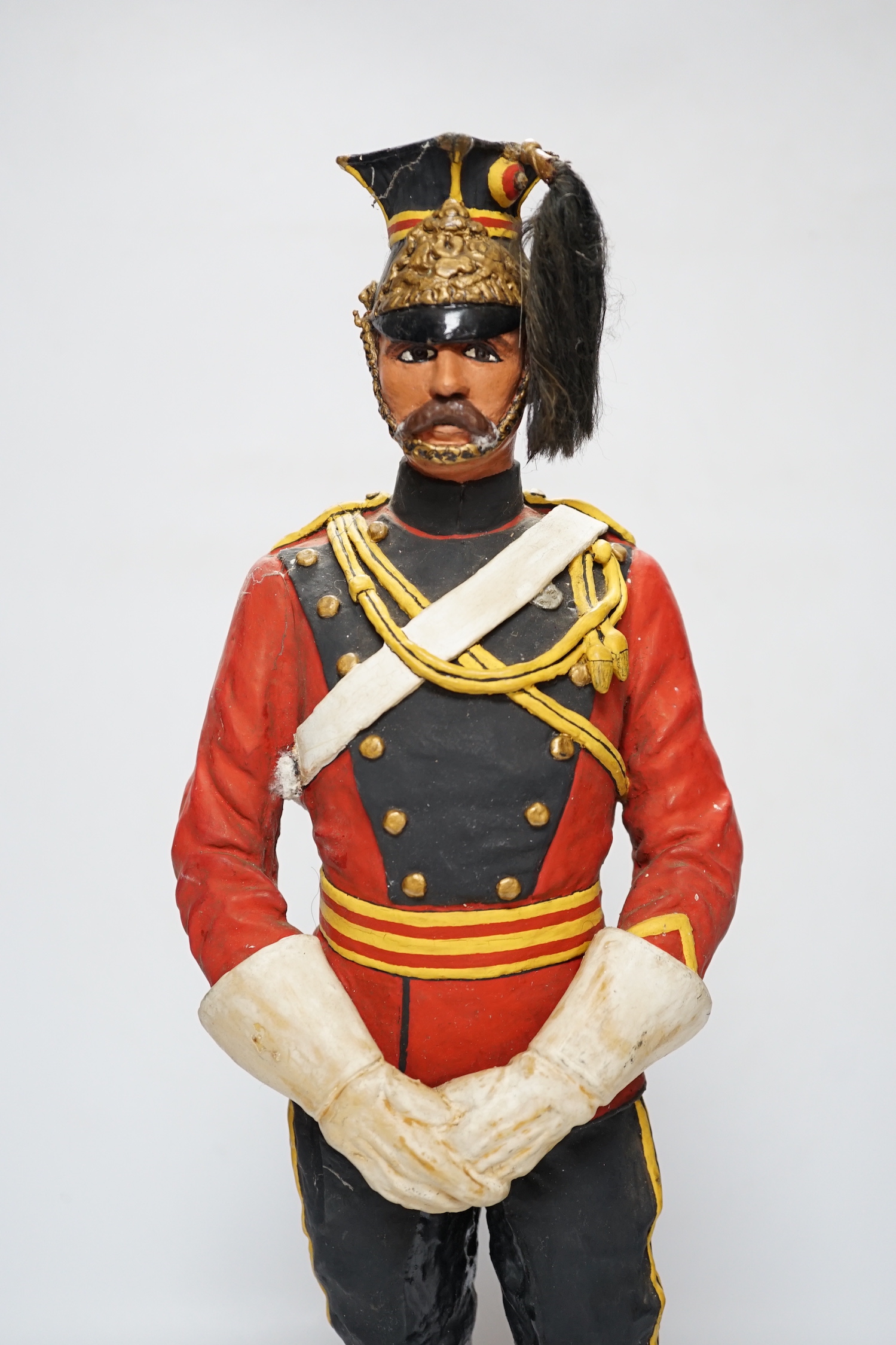 A painted plaster figure of a lancer, 48cm